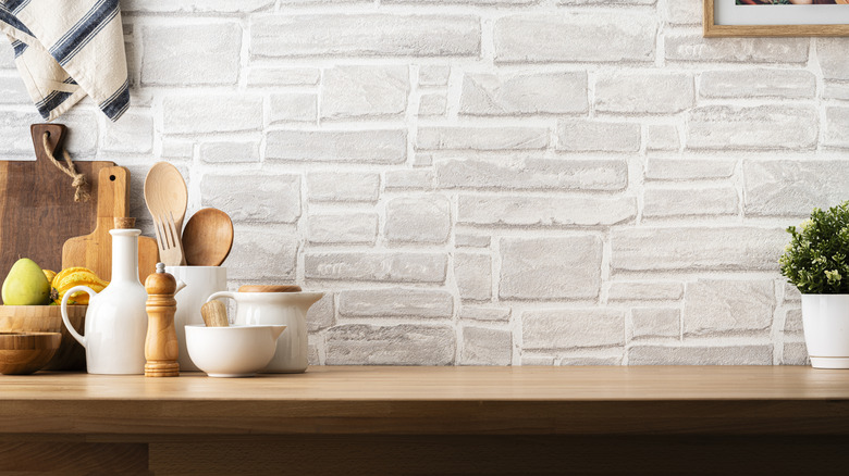Kitchen interior with a gray brick backsplash