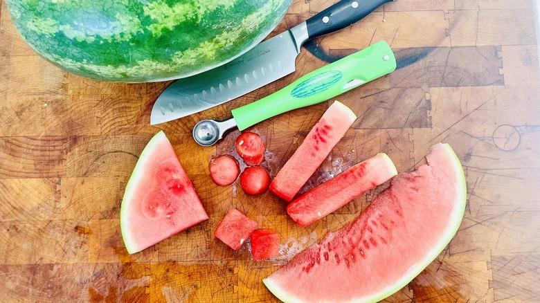 Various cuts of watermelon with melon baller and knife