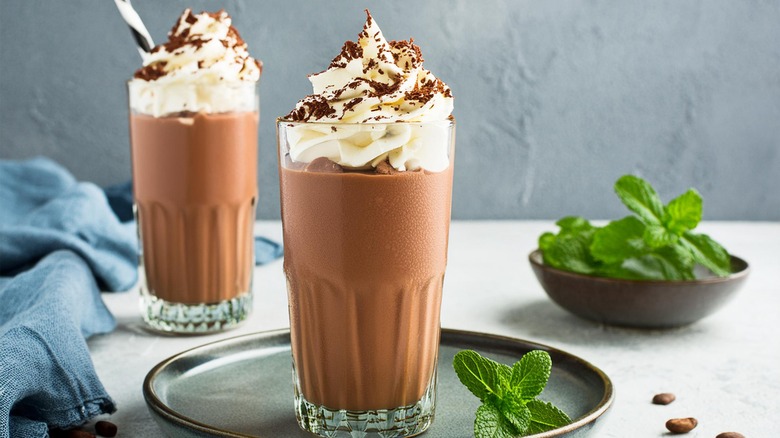 Two glasses of chocolate milkshake