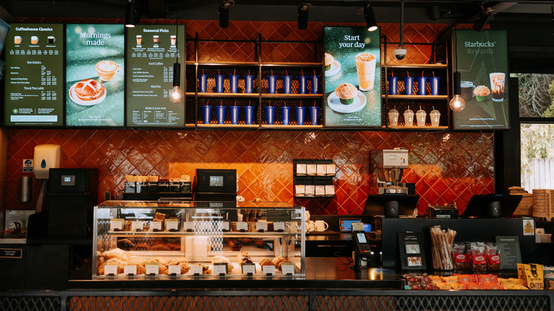 Starbucks menus on the wall of a UK location