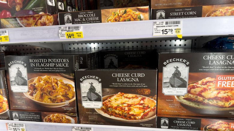 Various Beecher's frozen food products are shown in a supermarket freezer case