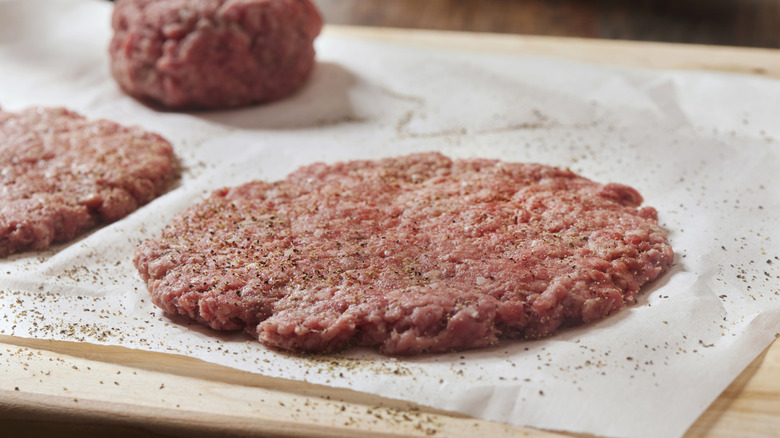Burger patty on parchment paper