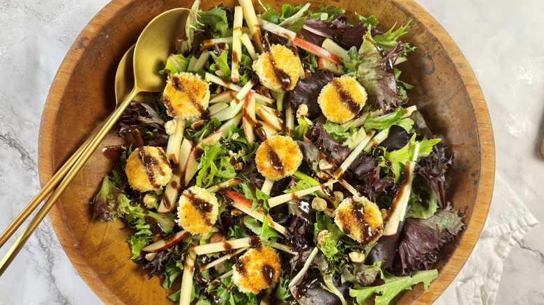 Goat cheese and apple salad in bowl