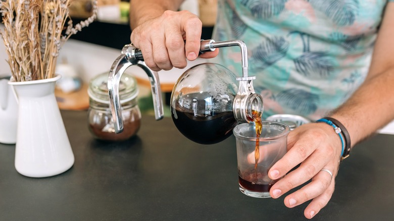 Siphon coffee poured into glass