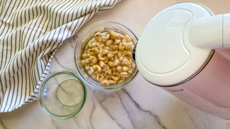 pouring hot water on cashews