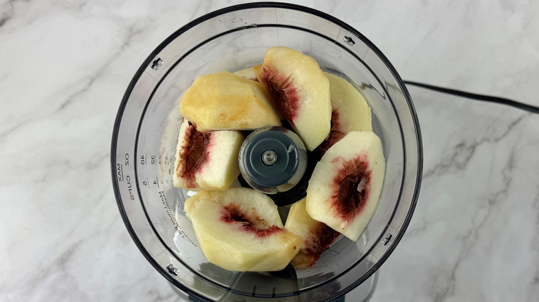 chopped peaches in a blender
