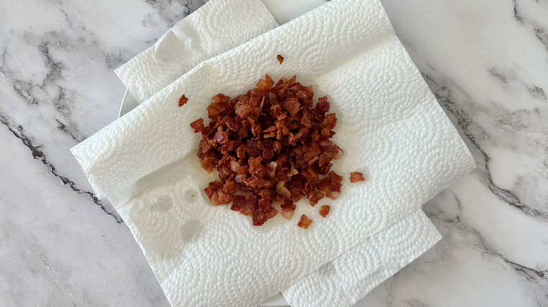 crispy bacon drying on paper towel