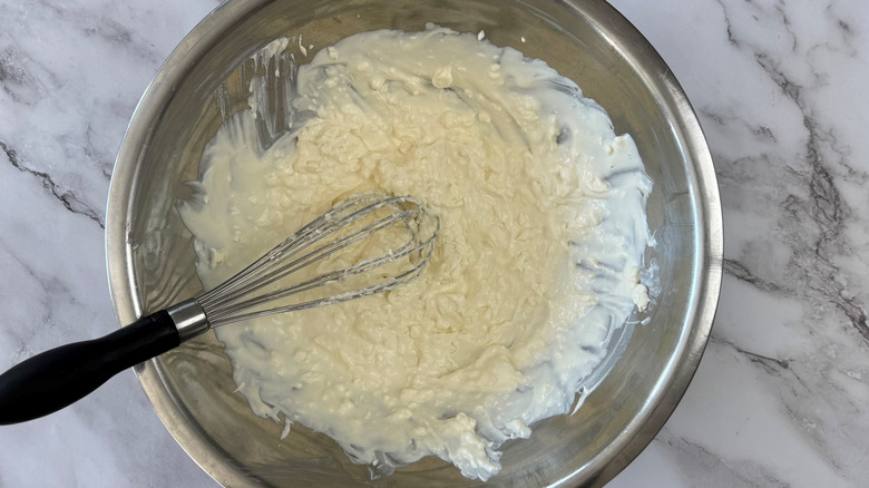 whisked cream cheese, mayo, and sour cream in bowl