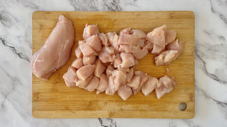 chopped chicken on cutting board