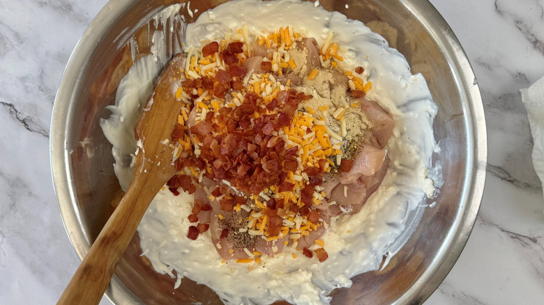 cheese and bacon in cheesy mixture