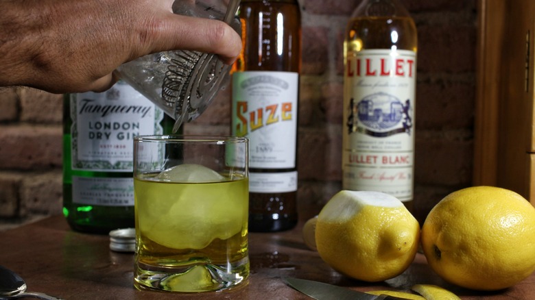 straining white negroni