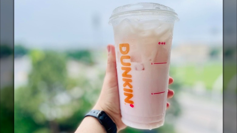 Hand holding Sabrina's Strawberry Daydream Refresher
