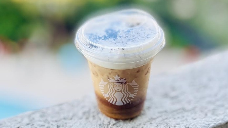 Starbucks Cookies on top drink sitting on outdoor ledge