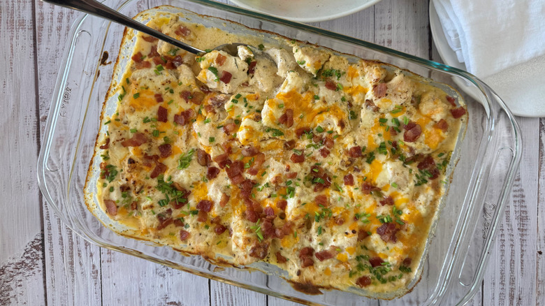 cheesy creamy chicken casserole with spoon