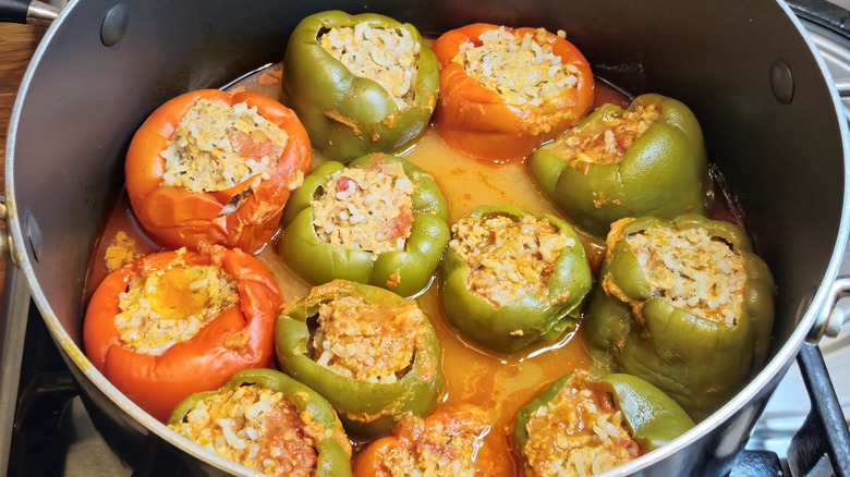 A pot of stewing stuffed peppers.