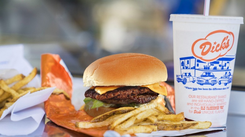 A double cheeseburger and fries with a soda from Dick's