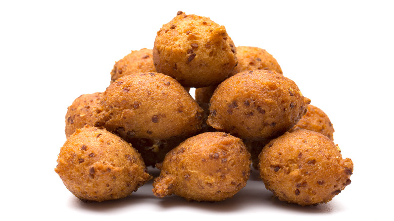 Pile of crispy hush puppies neatly arranged