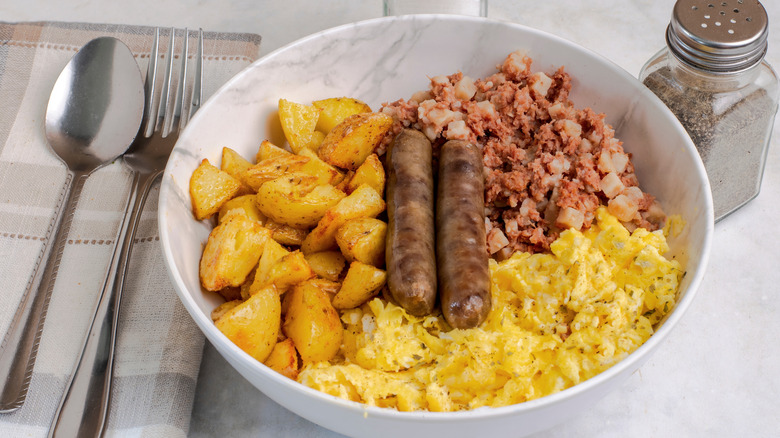 breakfast bowl with egg potato meat