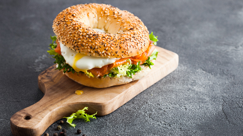 egg sandwich on a wooden cutting board