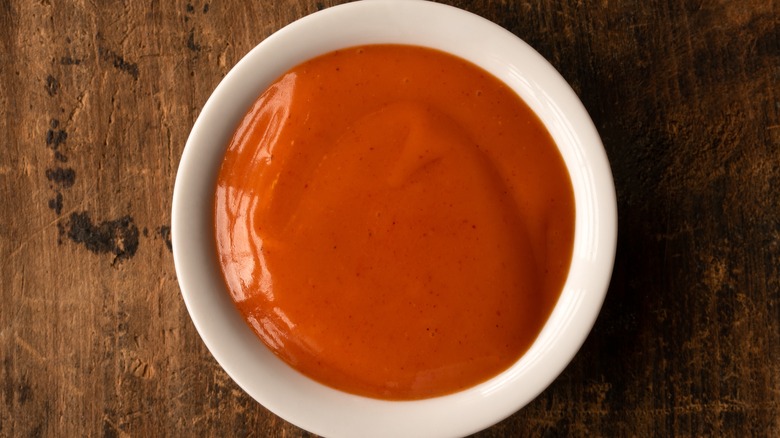 Small bowl of buffalo sauce