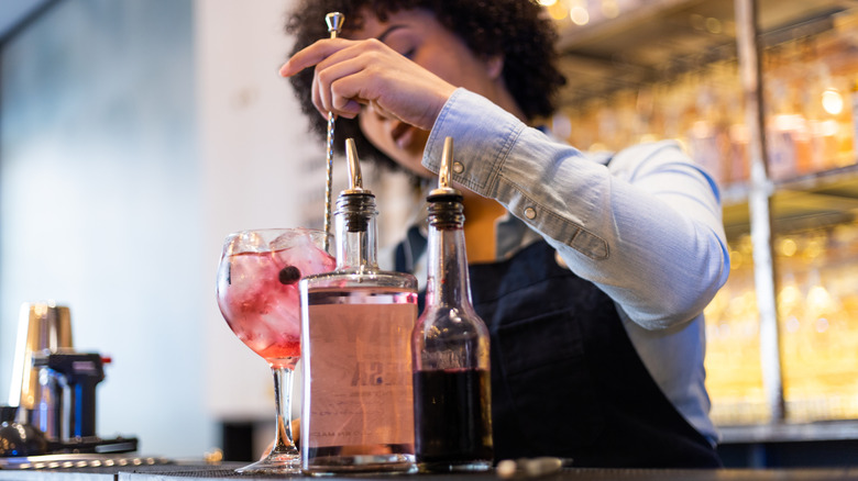 bartender mixing a drink