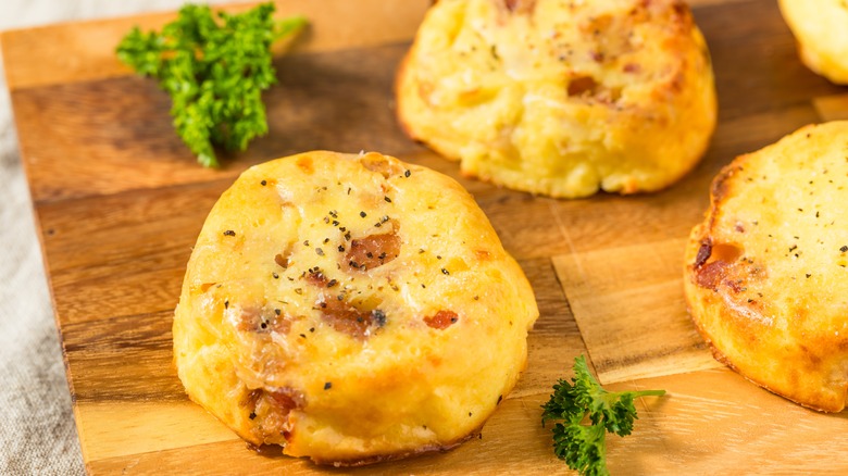 A plate of egg bites garnished with fresh parsley