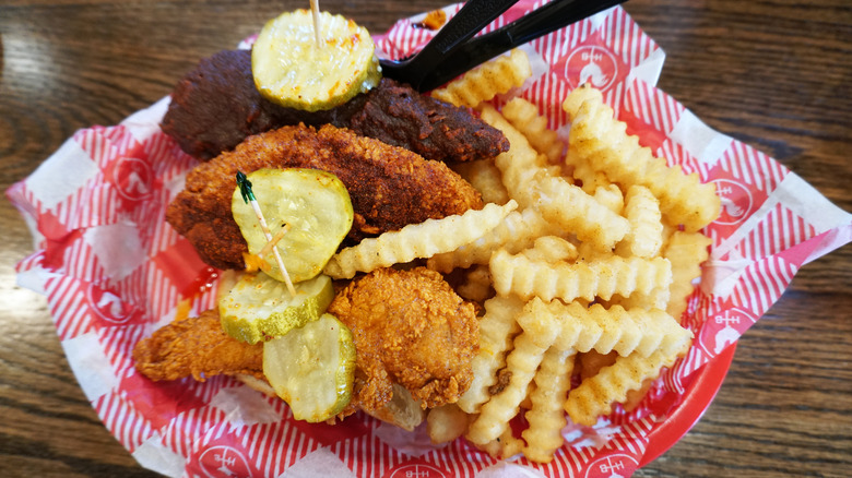 A basket of Nashville hot chicken and french fries from Hattie B's Hot Chicken